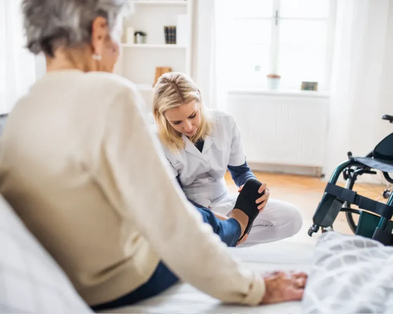 Elderly patient with caregiver at home